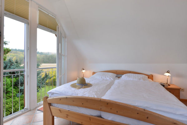 Schlafzimmer der Störtebeker Appartements im Ferienhaus am Hafen in Ralswiek auf Rügen